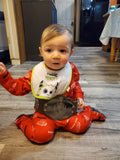 Baby seated inside kitchen wearing 28" Mini World Champ Belt around waist
