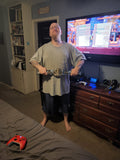 Tall man inside own bedroom posing with 28" Mini Championship Belt - Blue Camo Belt / Gold Plates