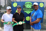Three adults pictured, two of which are Pickleball winners, each posing with their 28" Mini Pickleball Belts