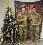 Two service men posing with Christmas tree, the 28" Mini Championship Belt is on left and 18" Mini Championship Belt on right