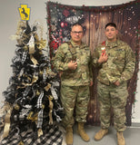 Two service men posing with Christmas tree, the 28" Mini Championship Belt is on left and 18" Mini Championship Belt on right